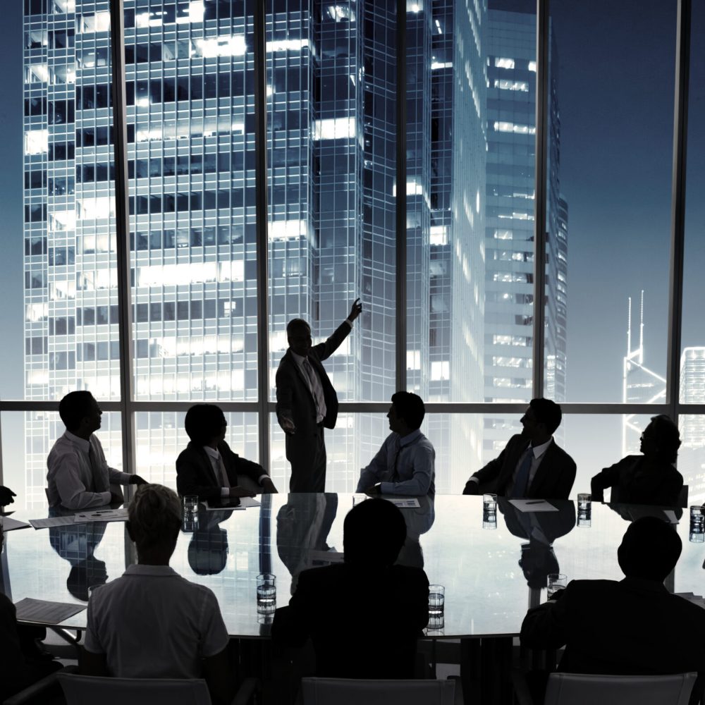 Business people in a board room meeting